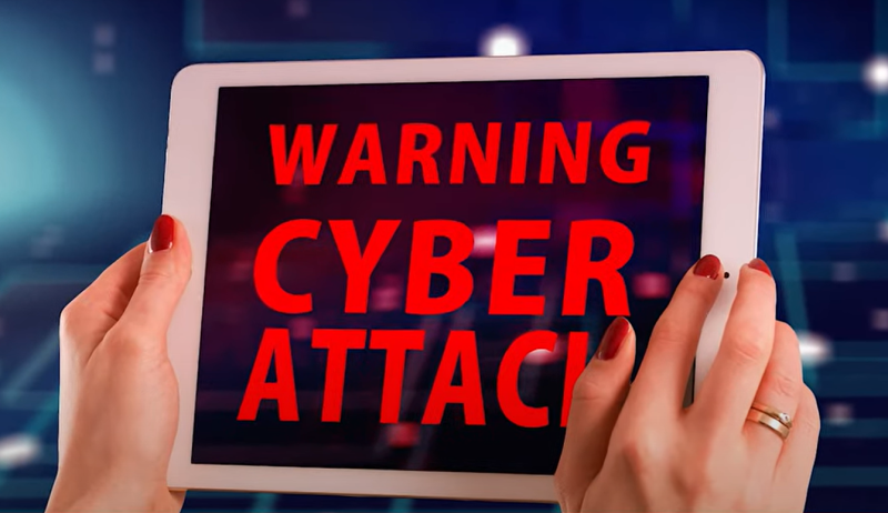 A pair of hands grabs a hacked cell phone screen